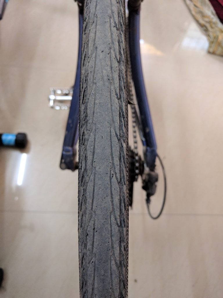 The read tread. This has worn past the porous rubber (visible in the front tyres).