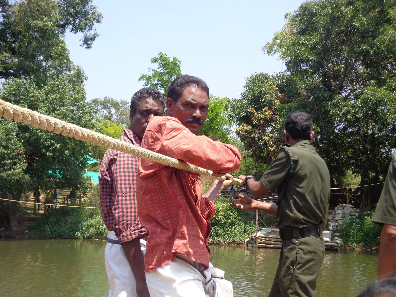 People pull the raft using stationary ropes running from the mainland to Kuruva island.