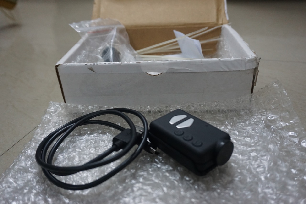 The camera has a base mount and an USB connector. There are some tidbits inside but they are of no use for me. Dhananjay threw in some zip ties that came handy.