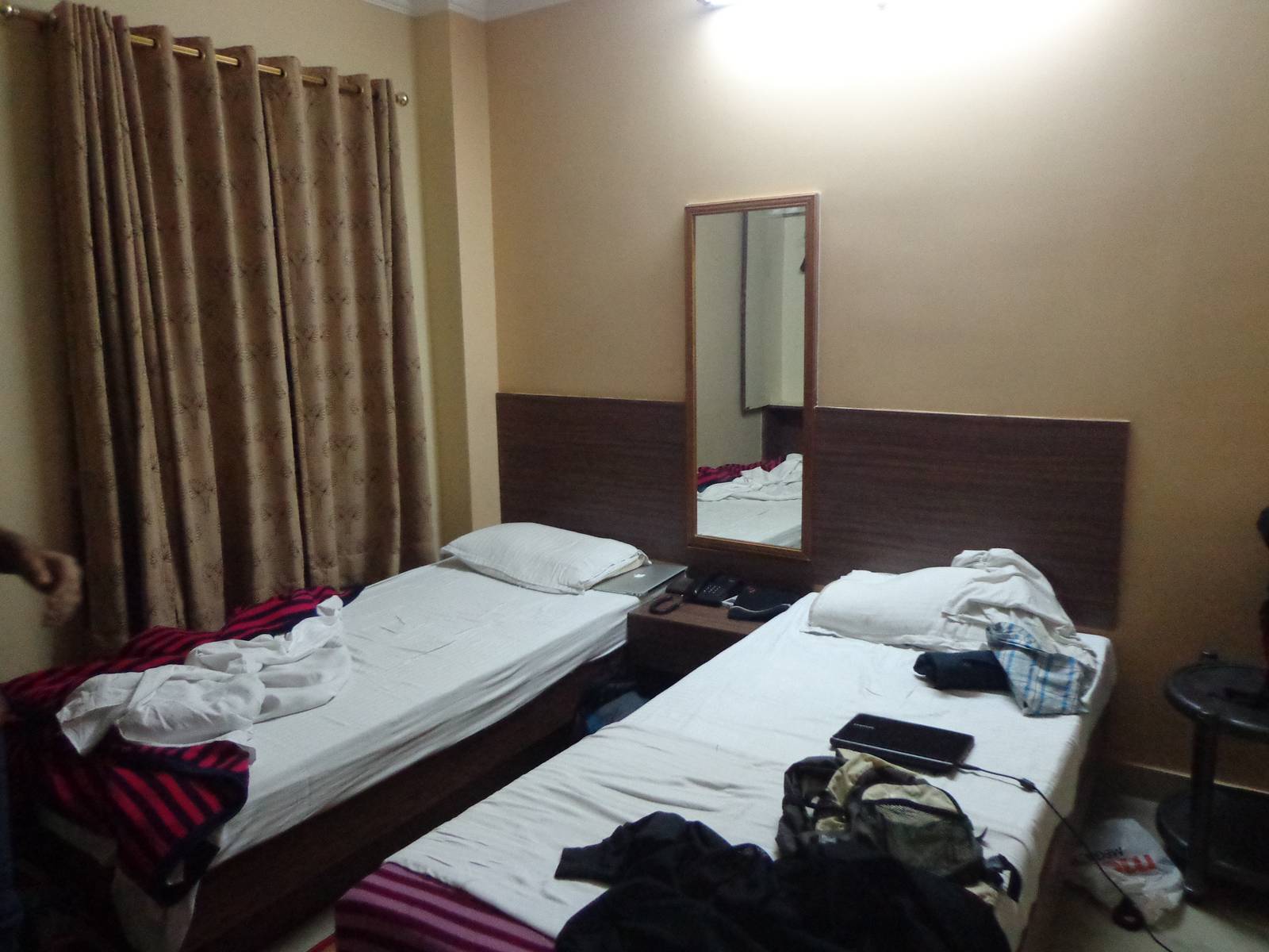 This is room 315 of Maitri Residency. The other wall has a TV mounted on it.