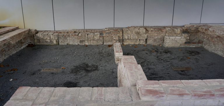 Remains of the ground floor of one of the buildings. The thick square blocks were used to seal windows.