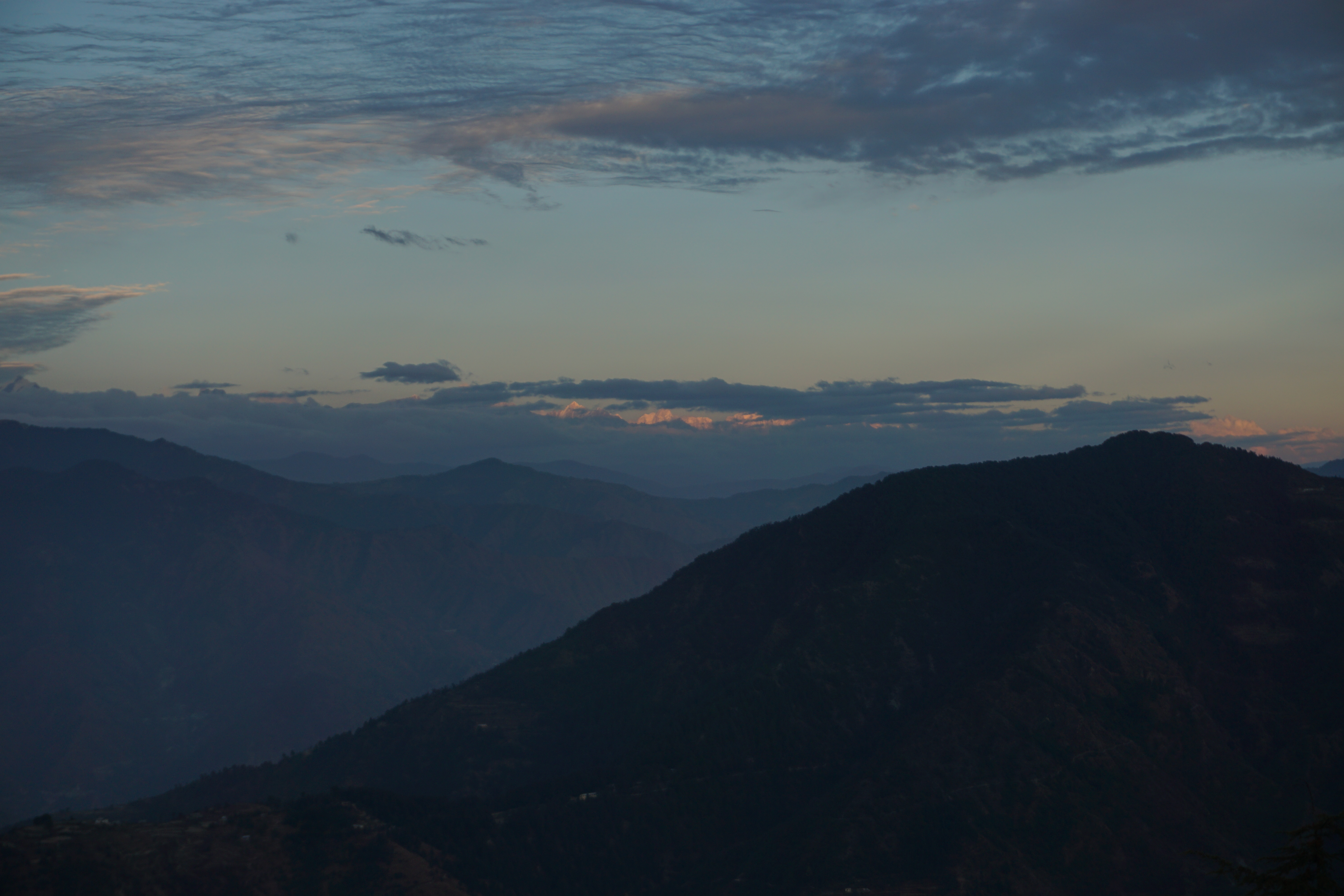Visitors were trying to see farthest hills in the centre through the mounted binocular.