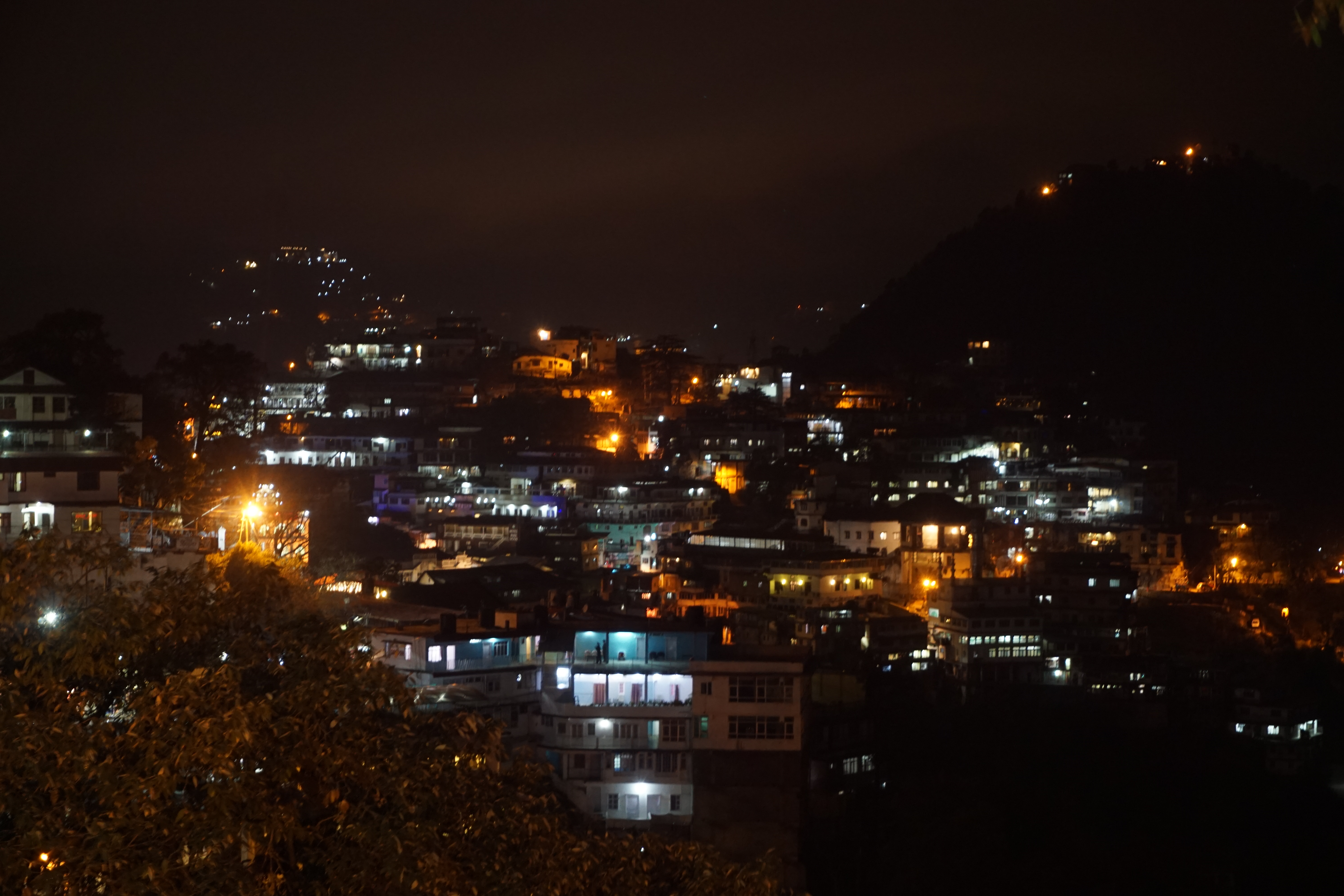 The settlement around market area at night.
