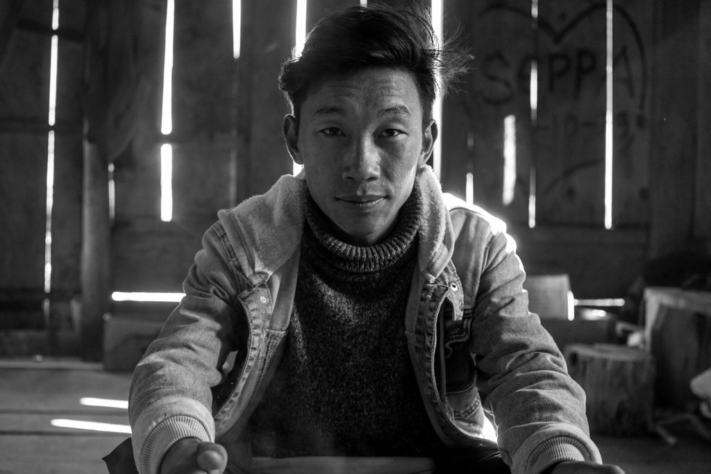 Dawa warming his hands. This is one of the better portraits I had clicked during this trip.