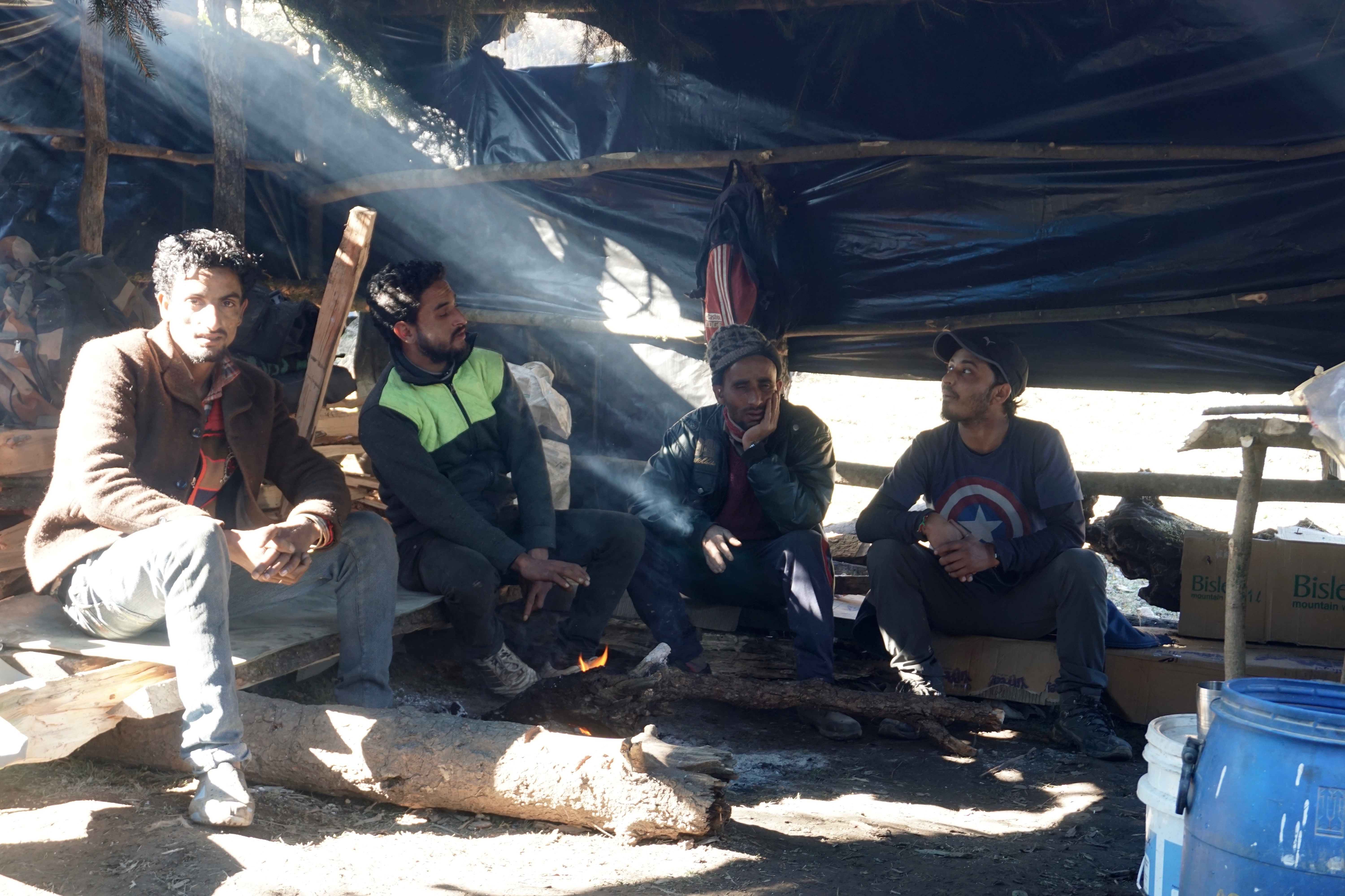 Dev chatting with his fellow villagers in the tea shop.