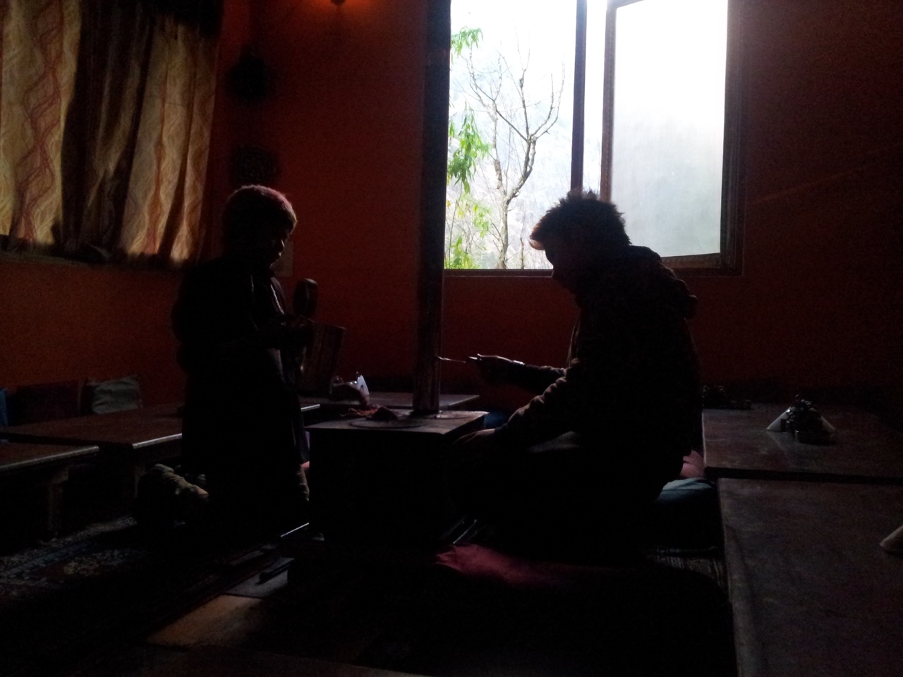 Two workers preparing the heating system for the night.