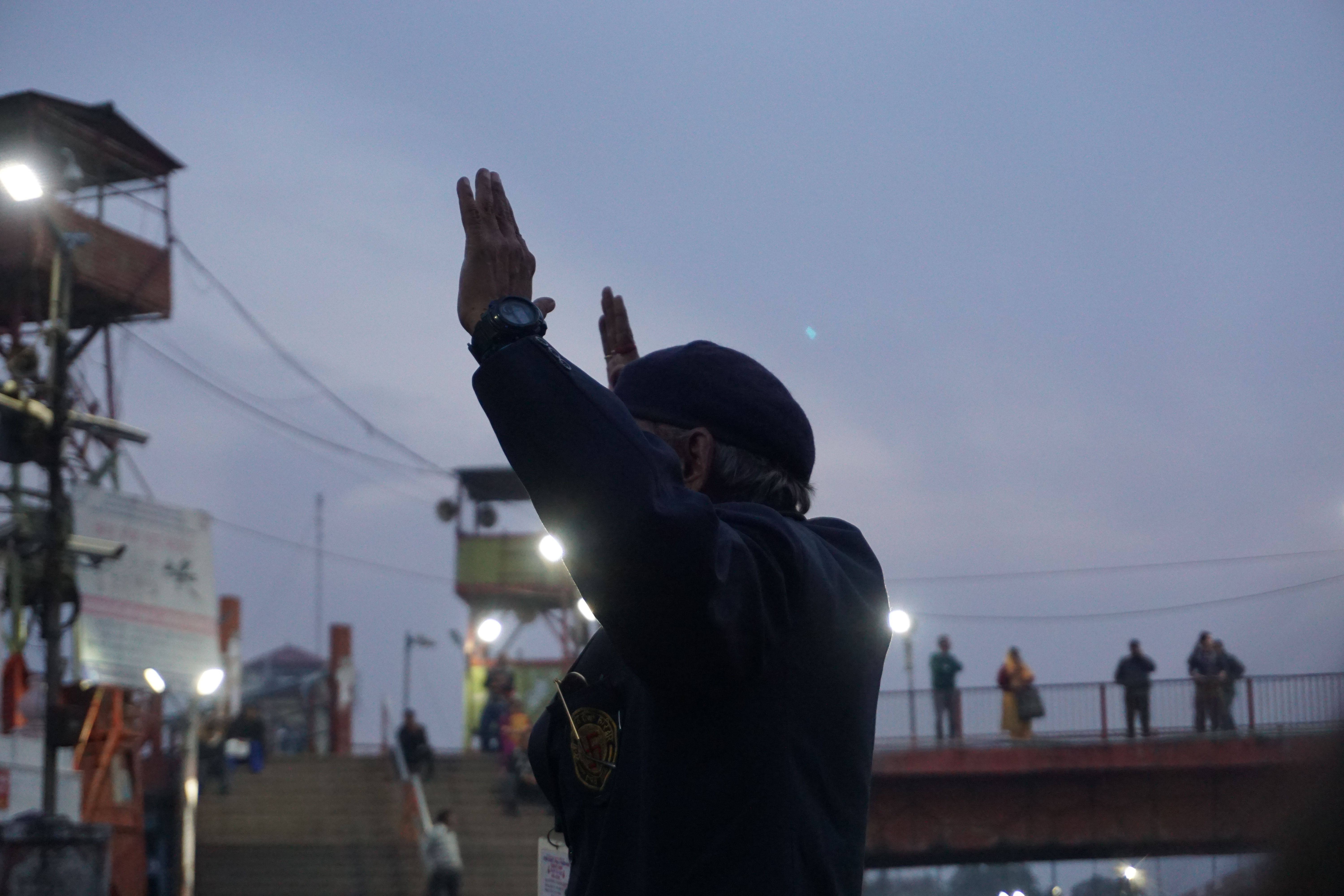 A Sri Ganga Sabha Samiti member organising the crowd. Once the aarti was over, they went around seeking donations for maintenance of the ghats and various other public services they offered to the devotees including medical help.