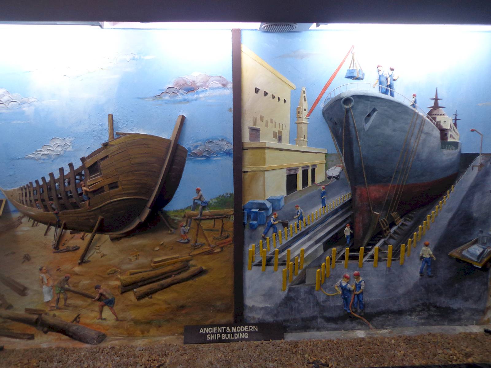A relief comparing medieval and modern shipbuilding methods in Calicut.