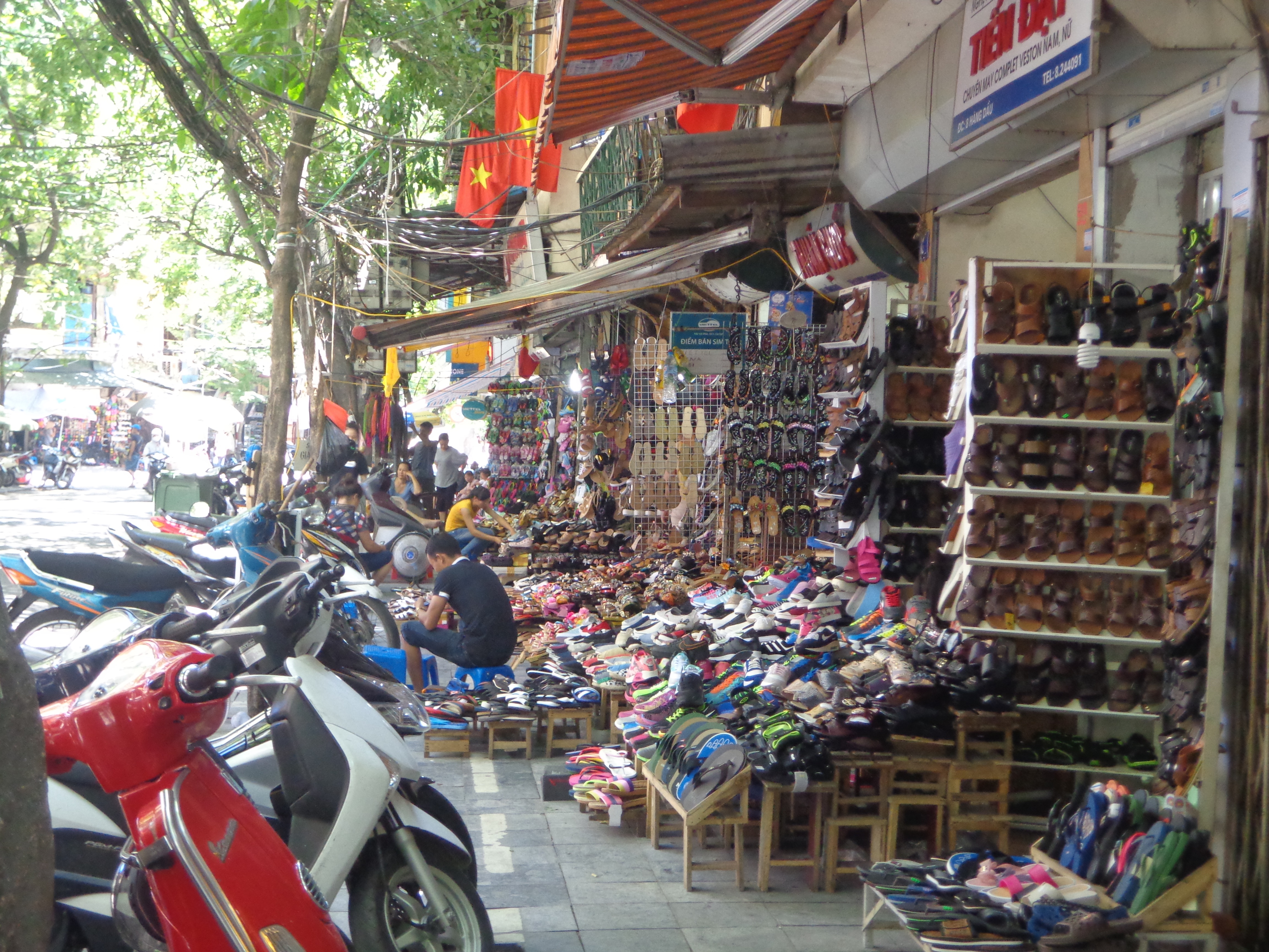 The lanes around Hoan Kiem lake specialise in various types of shops. This particular lane sells only shoes.