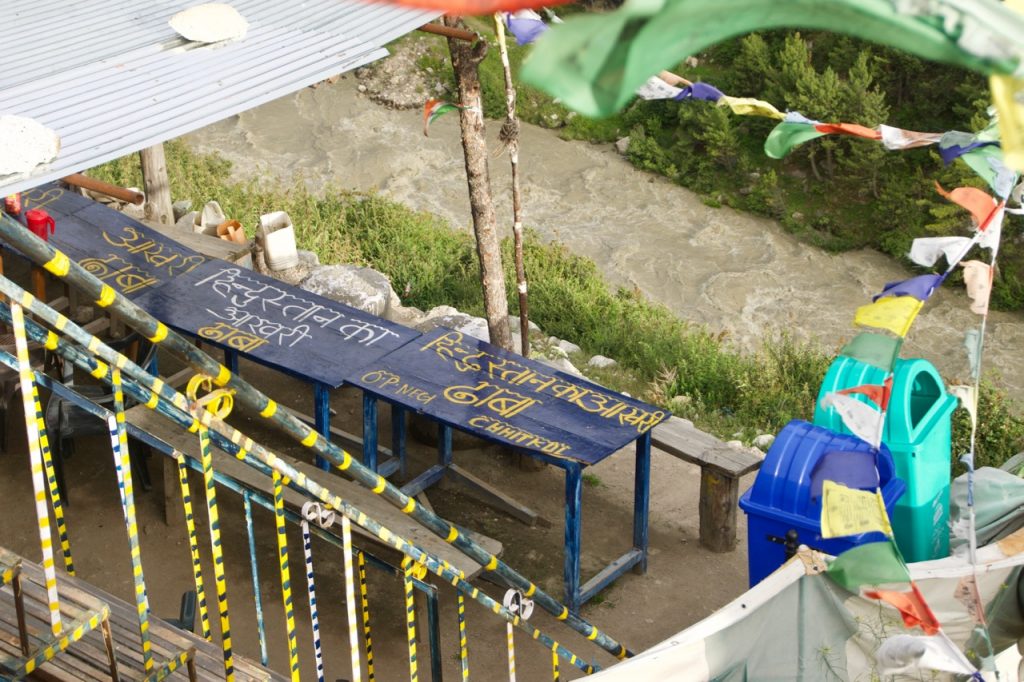 The branding is reflected on his wooden tables. He has also ensured that he has the most unique view of the valley for his customers.