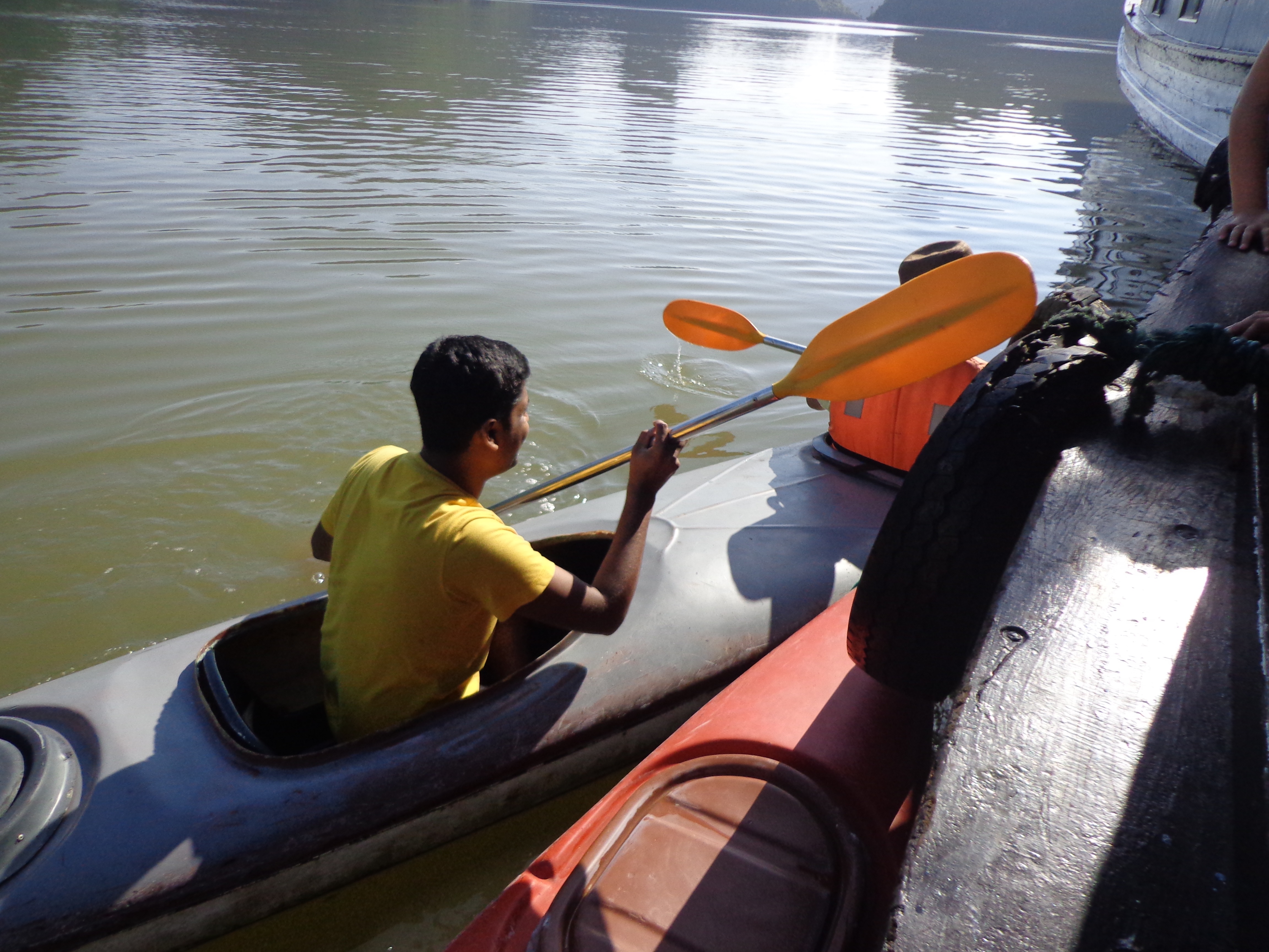 The railings of the utility boat was used as a support for the kayaks. It seems like all the lodging boats borrow from a common pool of kayaks.