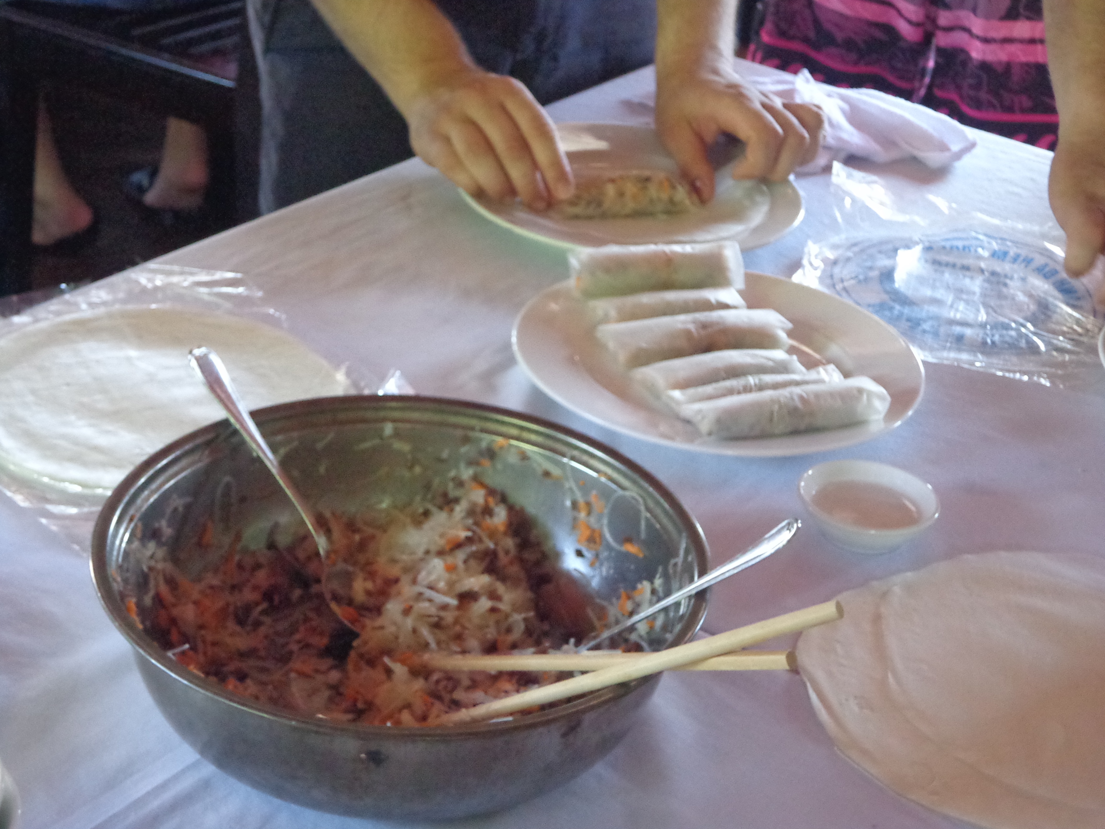 Wrap them all up to make the rolls. These are then deep fried. The ones they served later were of uniform size made by the cooks.