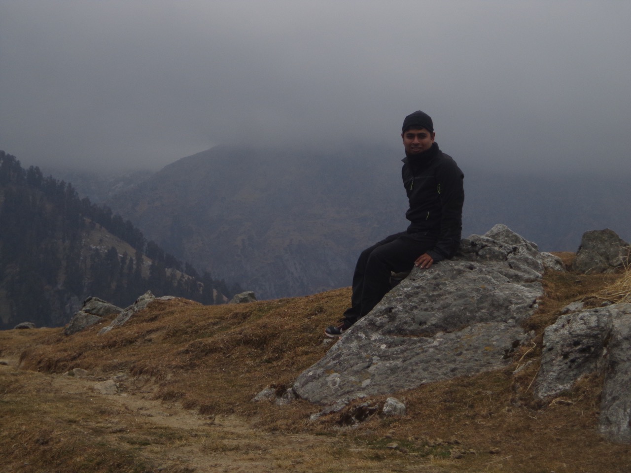 This is me posing with a darkened Dhauladhar range as backdrop.
