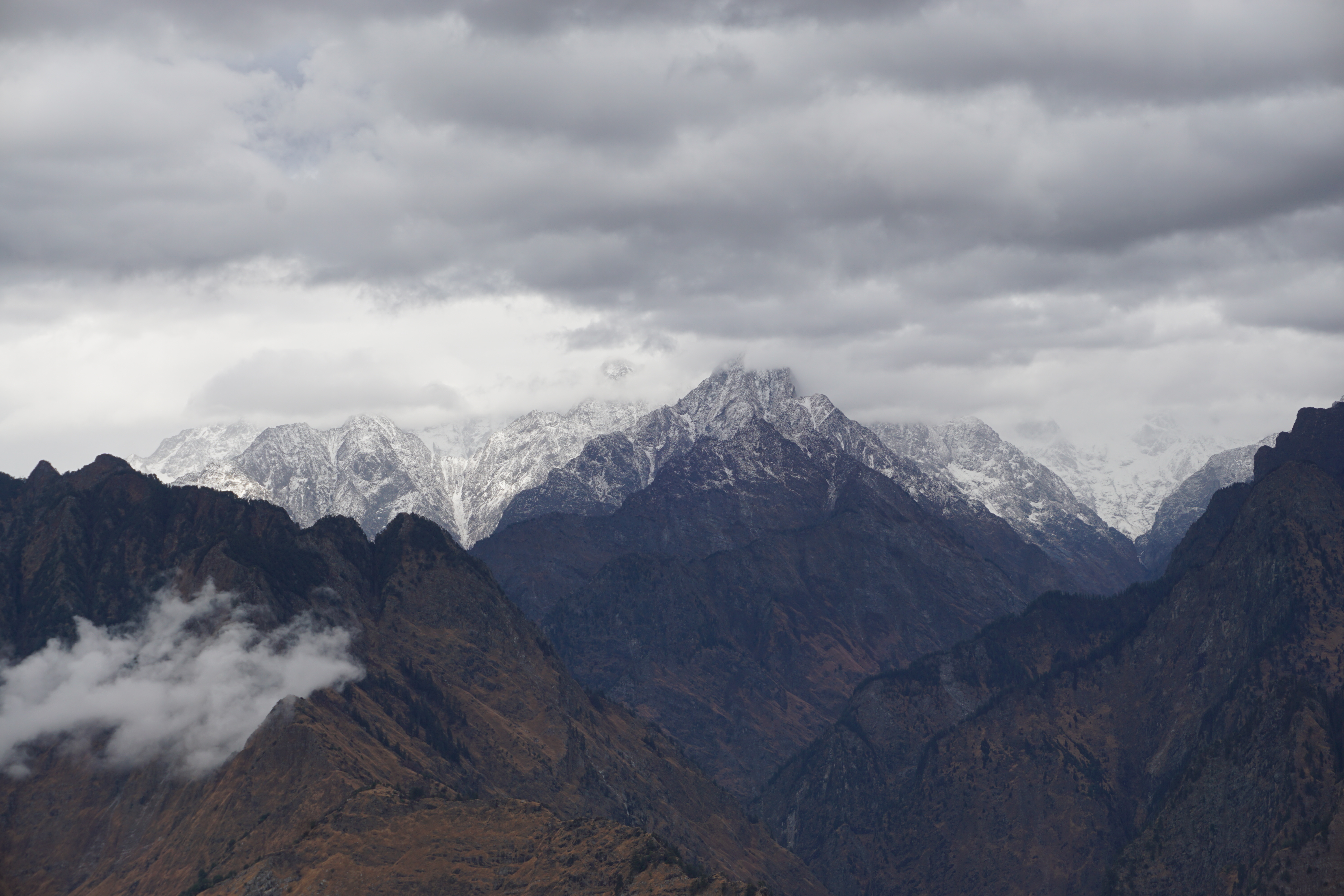 The murky and overcast sky did not allow for a clearer view of the mountain ranges.