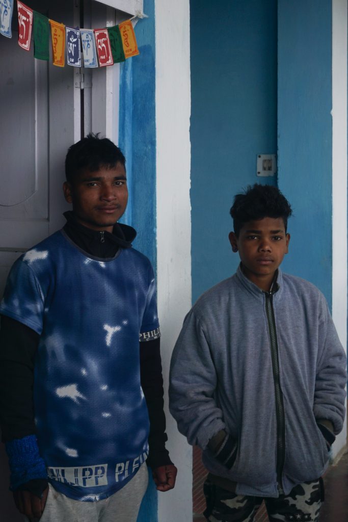 Akash and Amit from Hotel Samdrupling. They were painting the balcony walls and preparing for the owner&rsquo;s inspection who usually came once a month.