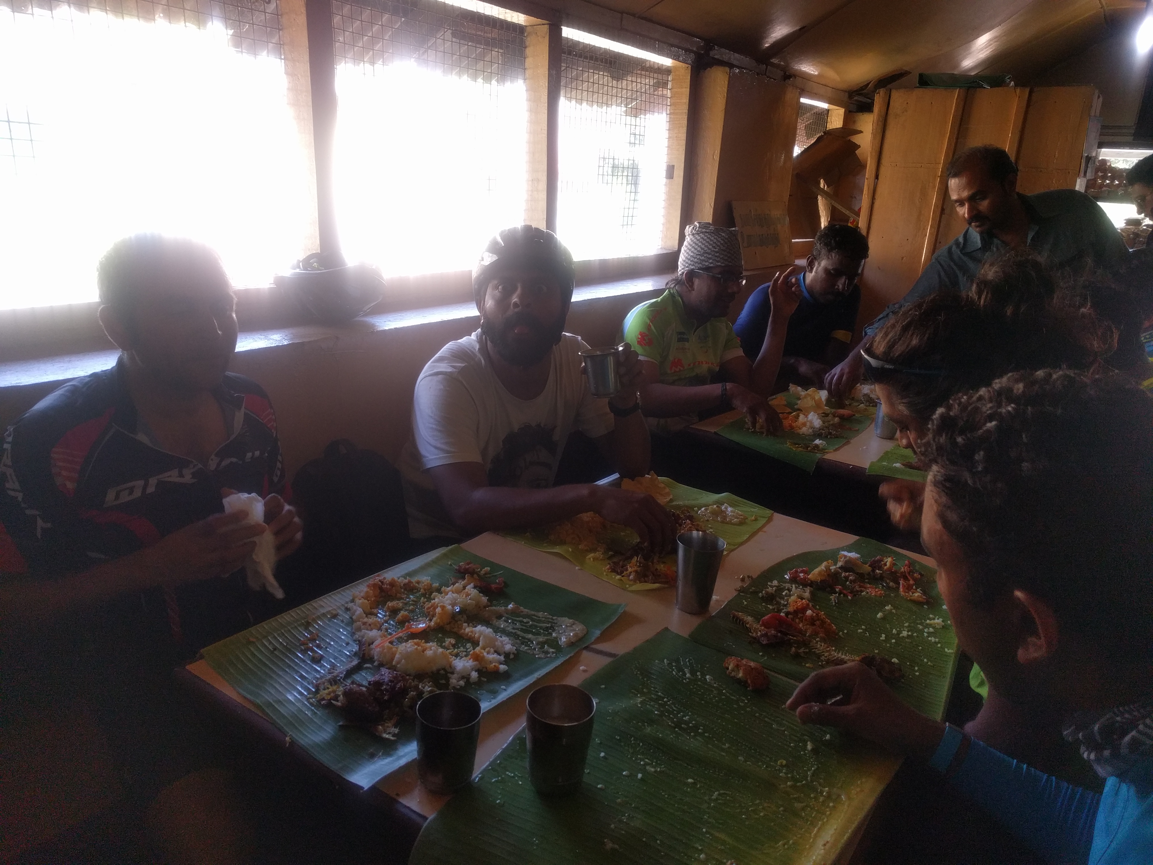 Riders and volunteers having lunch.