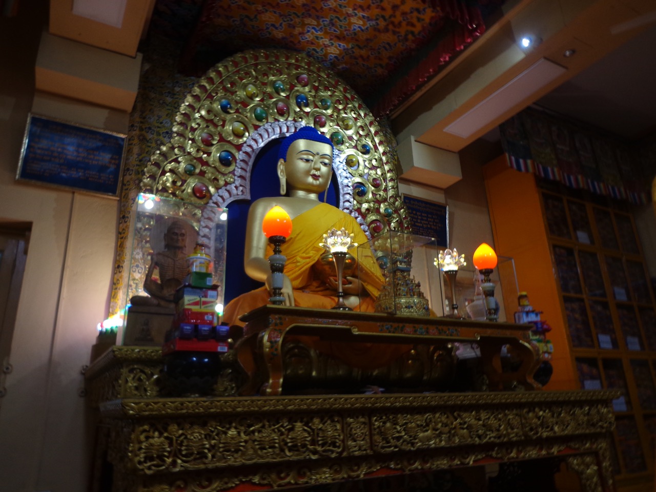 The Buddha statue of the temple. Some ancient scriptures are also preserved in this room.