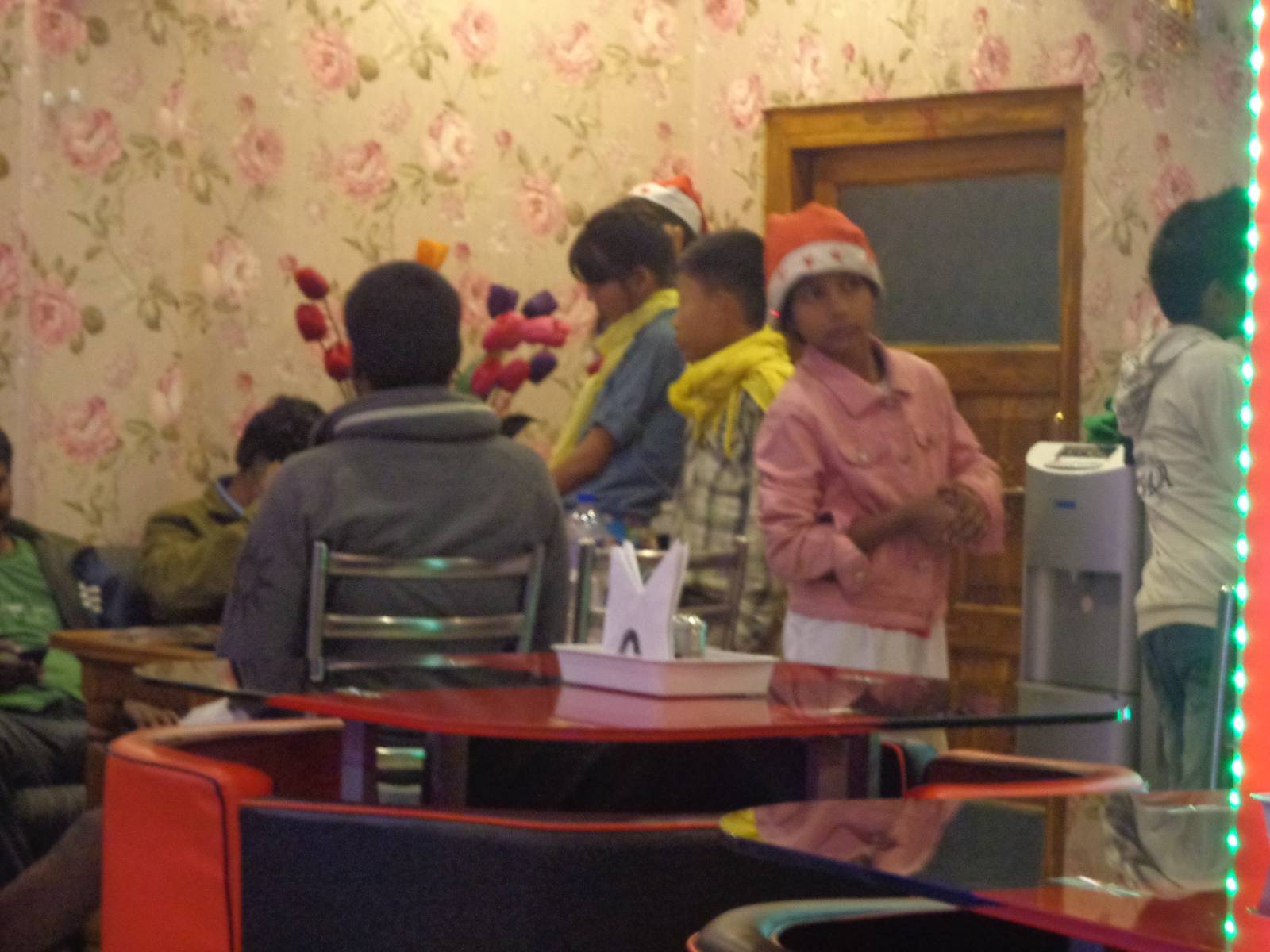 Kids asking for Christmas donations at the restaurant.