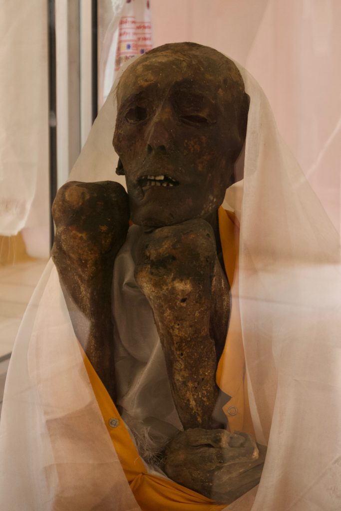 Lama Sangha Tenzin&rsquo;s mummy. If you have seen the documentary, then you&rsquo;d notice that the tattered, moth and maggot infested clothes—including the meditation belt—have been removed.