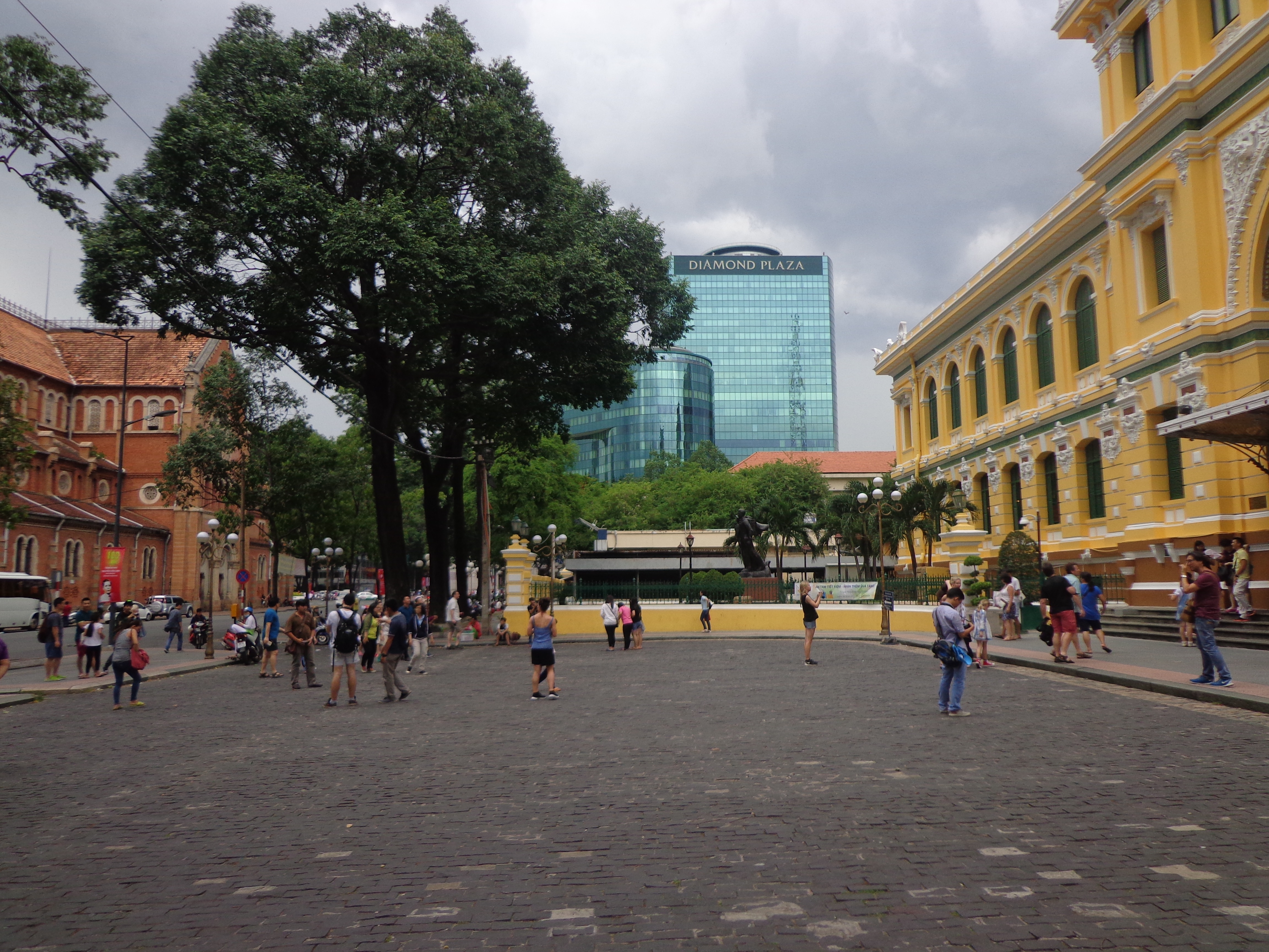 A lot of tourists gather here to click photographs. Between the two ancient buildings, we can see a modern office building peeking through.