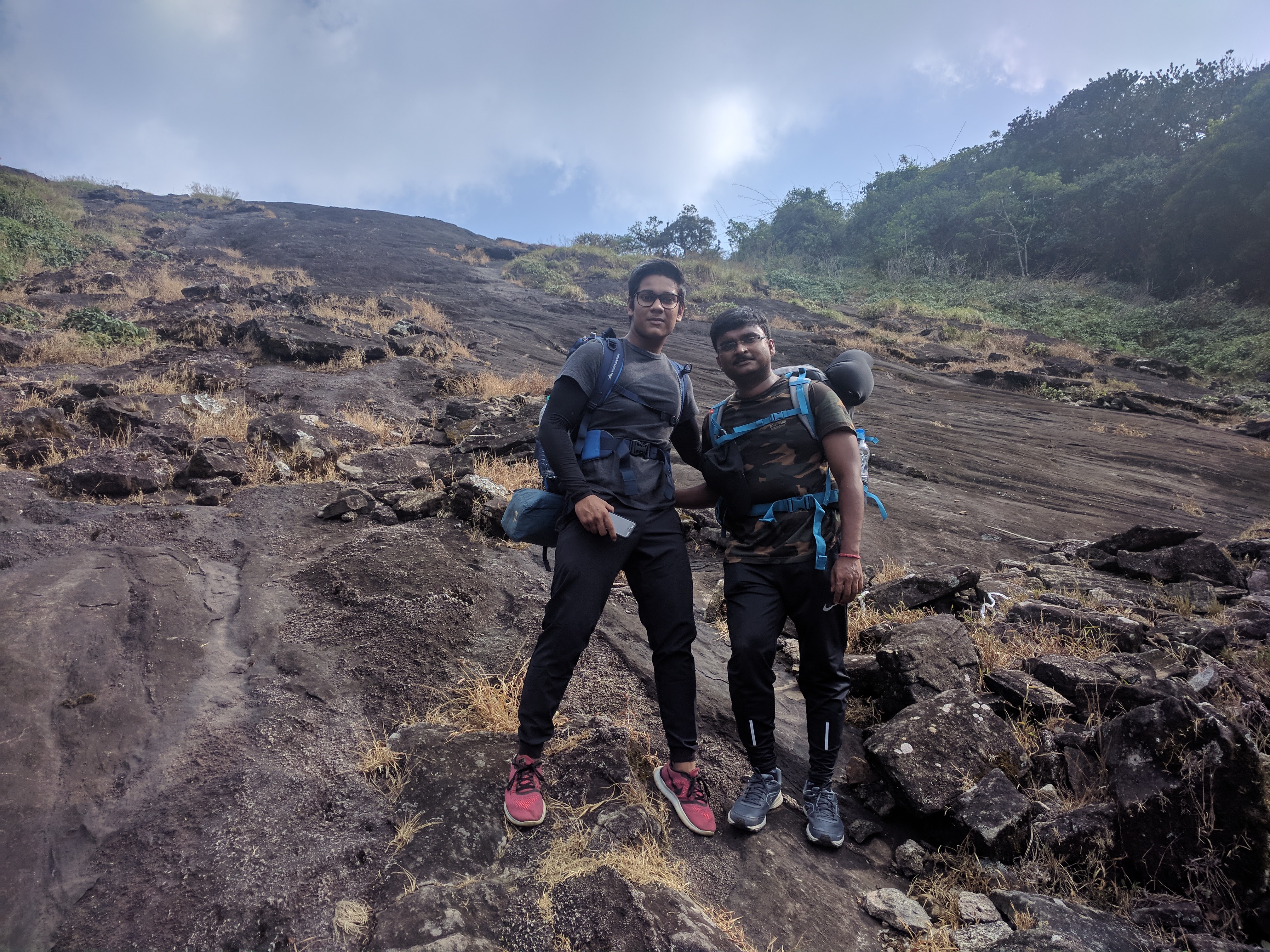 Atri and Arka, the brothers, posed for a photograph midway while ascending wall number two.