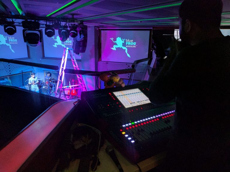 Mriganka equalising Korak&rsquo;s drumkit on the console placed on the upper floor of the venue.