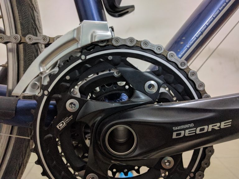 Band-on Deore front derailleur (FD-M610), 170mm Crank with 42/32/24 teeth chainrings (FC-M610) and 10 speed chain (CN-HG54). One of the link pins visible right in front of the downtube is black. This is a proprietary Shimano link pin. There was only one in the packet. I need to get a few spares and keep them in my saddle bag.