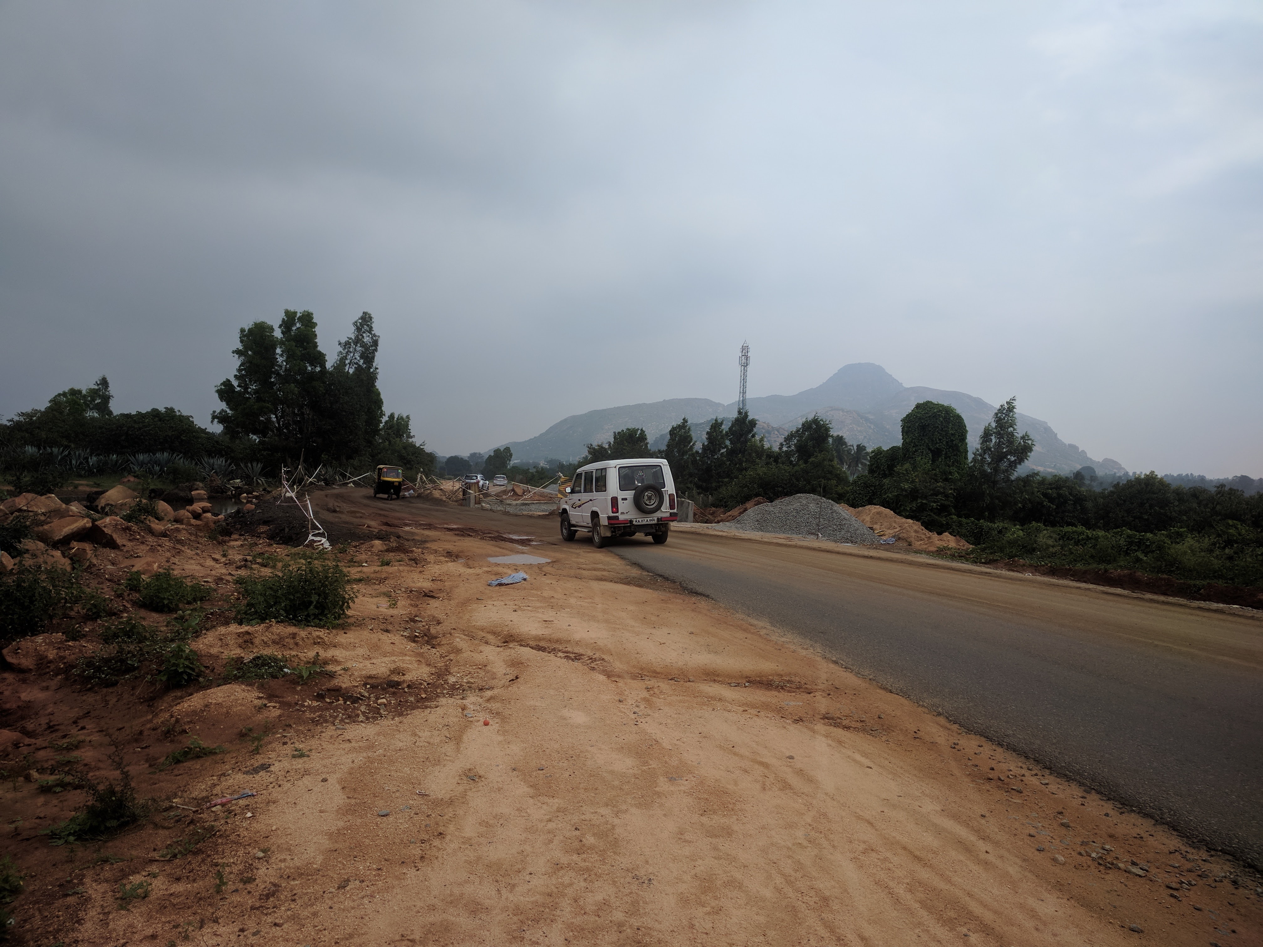I am standing on the road. A small stretch on one side is getting laid. The entire 36 km stretch was punctuated by such construction.