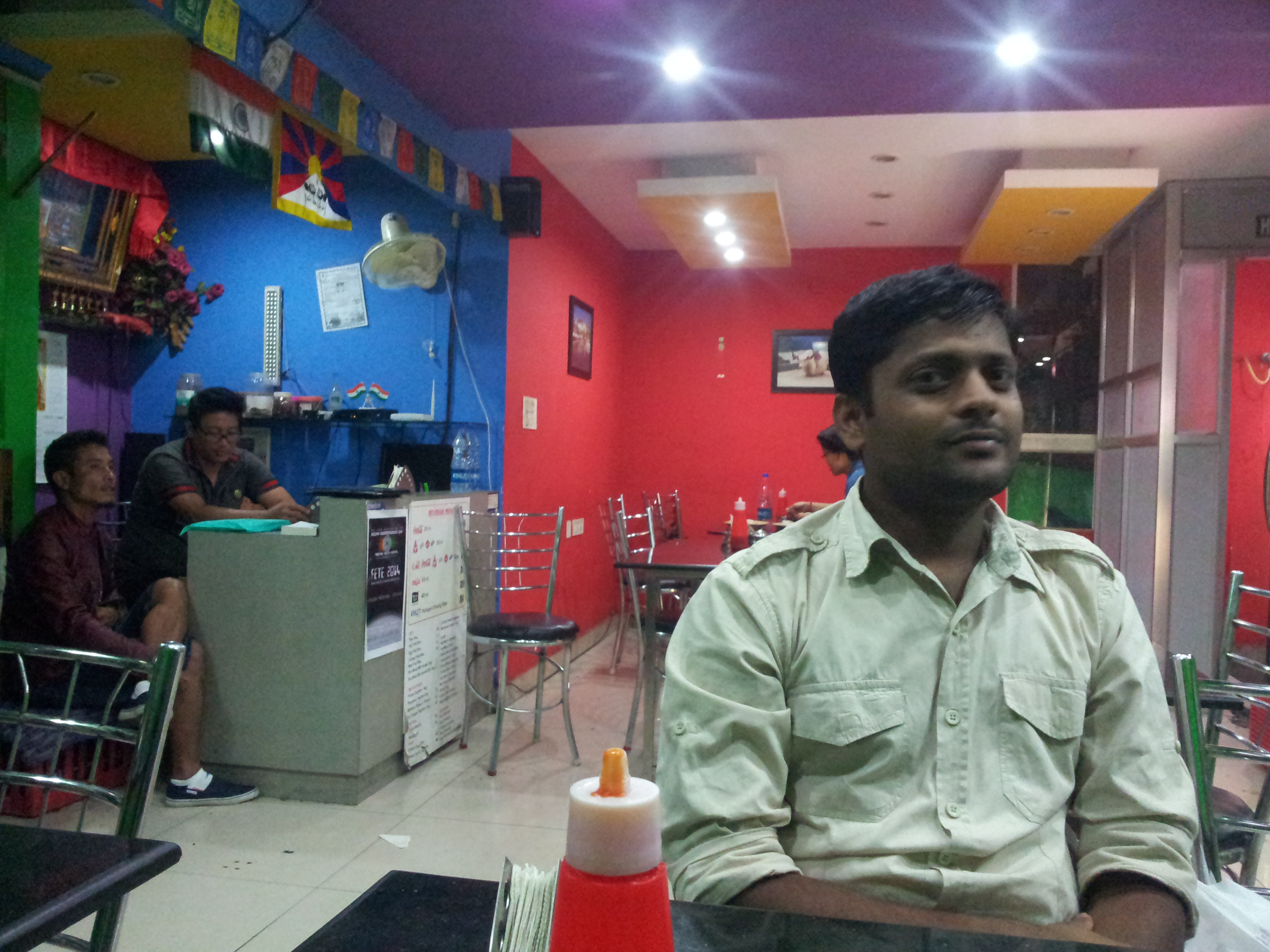 Amit staring at my mobile camera while I clicked a photograph of the place.