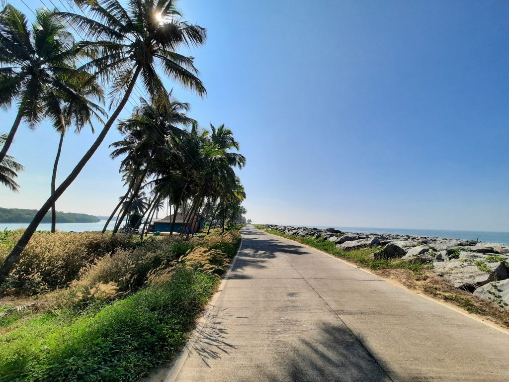 Malpe-Mattu road with the backwaters on its east and the sea on its west