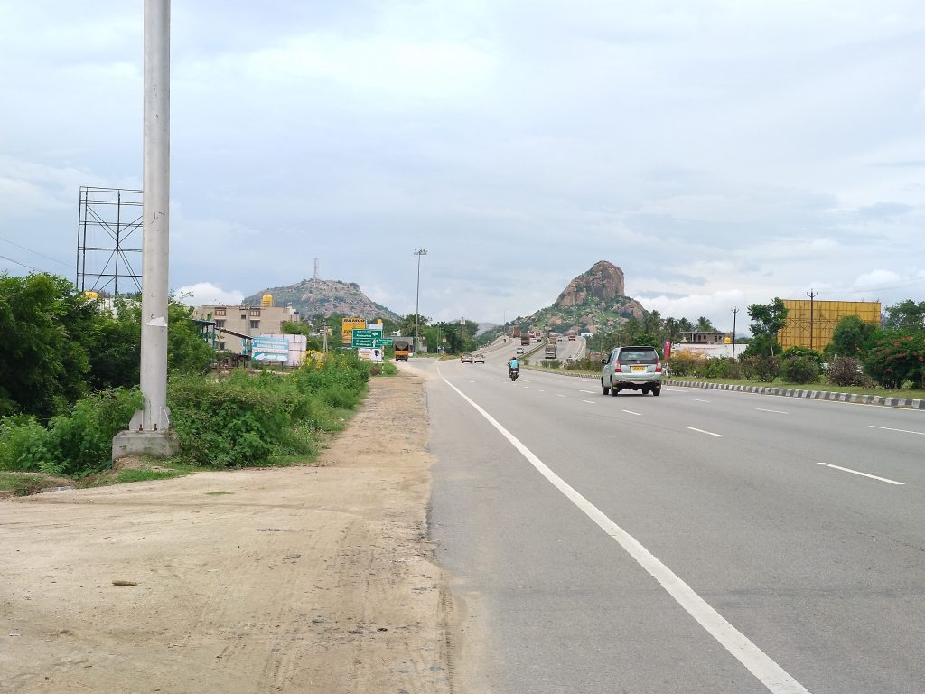 On the highway before Krishnagiri with a view of the hills.